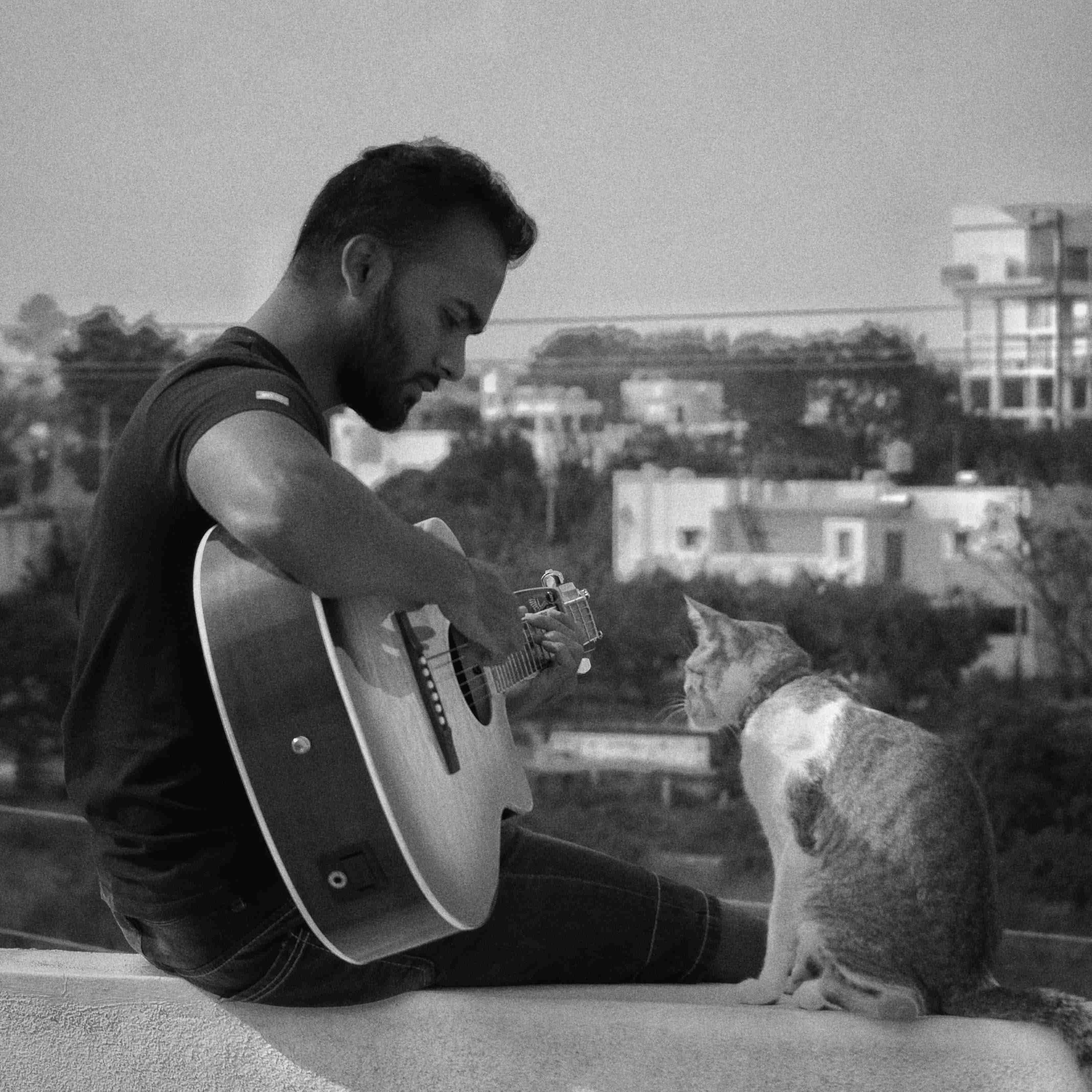 Shanmu playing guitar for Rose